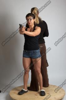 2021 01 OXANA AND XENIA STANDING POSE WITH GUNS (9)